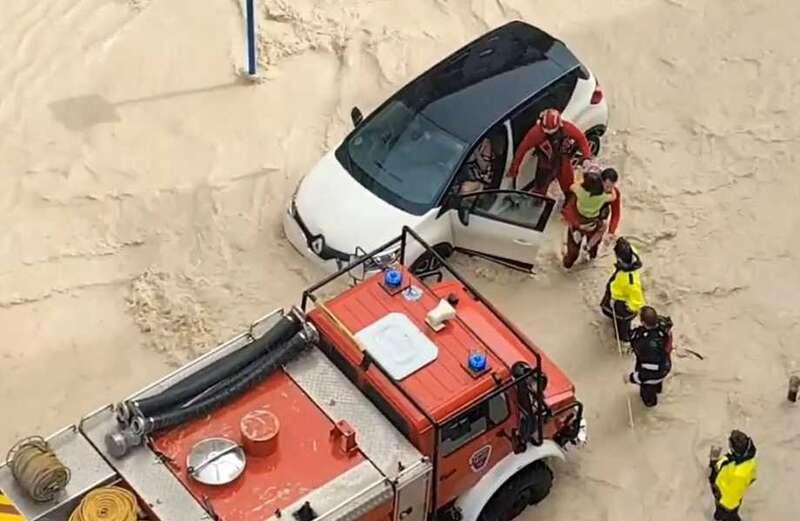 The runway of Palma de Majorca airport was covered in water deep enough for a worker to fall back and swim in