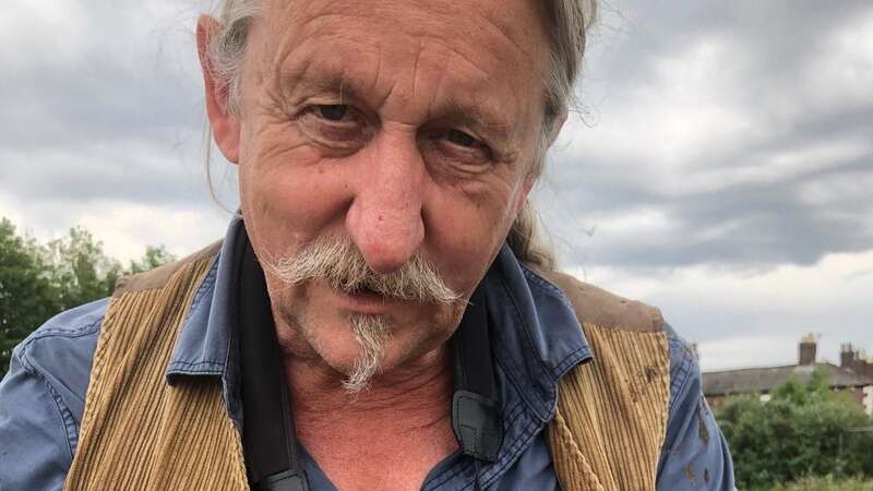 Roy Armstrong with a Herring Gull chick (Image: ​Armstrong ​McCaul Biological Co/SWNS)