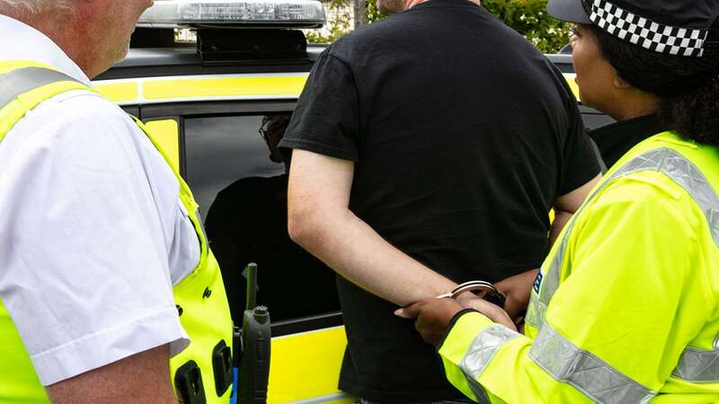 A man is handcuffed after an act of violence (file image) (Image: Getty Images)