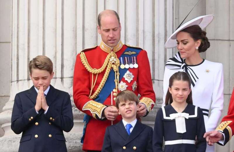 Kate and Louis were seen peeking out from the balcony