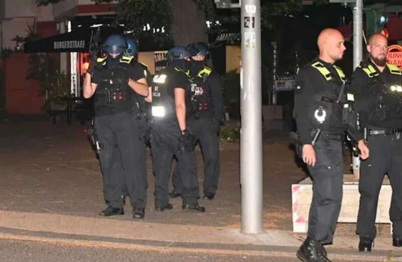 Hundreds of riot police officers armed with submachine guns have been deployed to search for the suspect