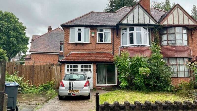 Outside the house with a ‘time travelling portal’ in the wall (Image: Jam Press/Paul Carr/Rightmove)