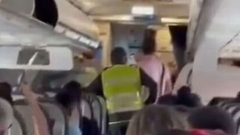 Footage of a young boy being removed from a plane in Colombia has emerged online (Image: No credit)