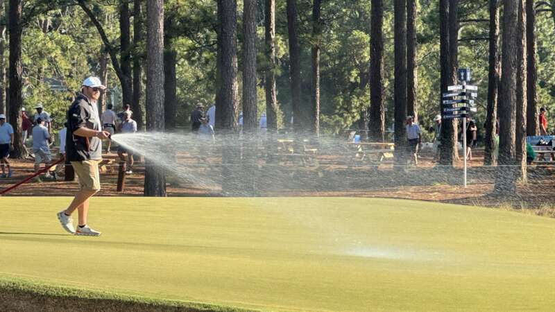 USGA officials have been watering the greens during rounds of play amid high temperatures at Pinehurst (Image: X @KylePorterCBS)