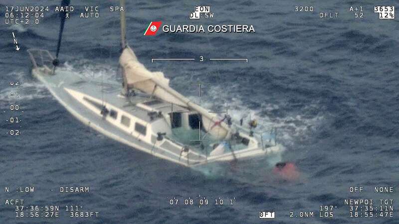 This photo taken and handout on June 17, 2024 by the Guarda Costiera, the Italian Coast Guards, shows a sailboat off the coast of Calabria (Image: GUARDIA COSTIERA/AFP via Getty I)