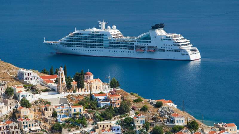 Around 800 vessels called and delivered almost 1.3 million visitors to Santorini last year (Image: Getty Images)