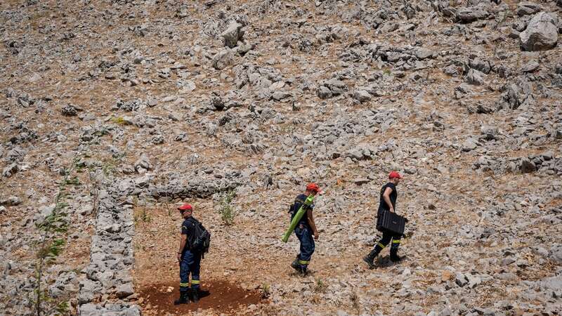 Firefighters take part in a search and rescue operation for a missing British journalist Michael Mosley before his body was found (Image: AFP via Getty Images)