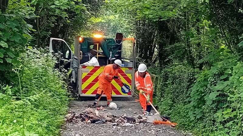 Workmen spent days cleaning fly-tipped waste from the fly-tipped area (Image: Shropshire Council/SWNS)