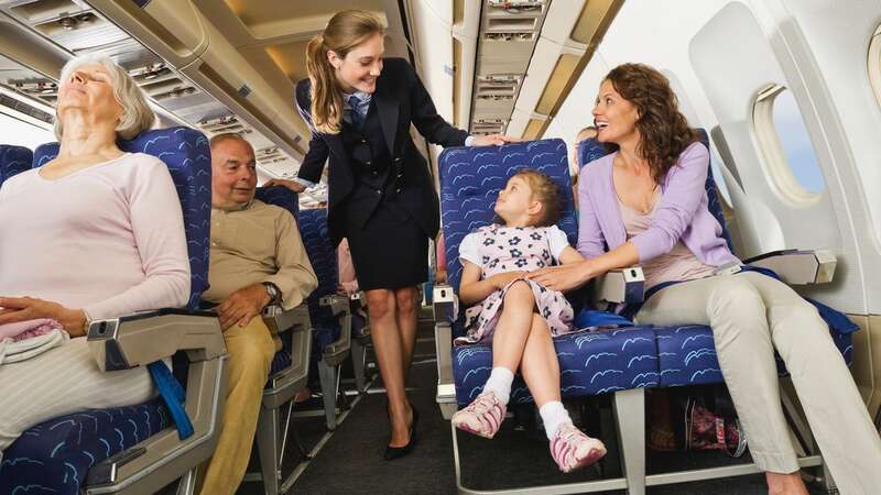 Keeping your little ones entertained on a long flight can be a challenge (stock photo) (Image: Getty Images/Westend61)