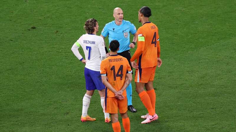 Referee Anthony Taylor speaks with Antoine Griezmann of France and Virgil van Dijk of the Netherlands (Image: UEFA via Getty Images)