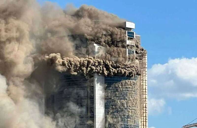 Watch horrifying footage showing monstrous plumes of smoke engulfing the high-rise as an entire road nearby was shrouded in acrid smoke