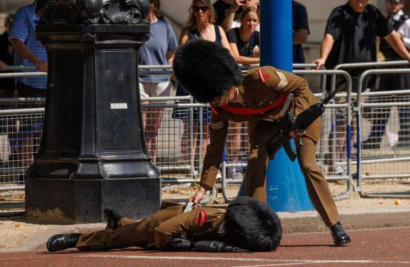 Another soldier kindly helps the guard to his feet