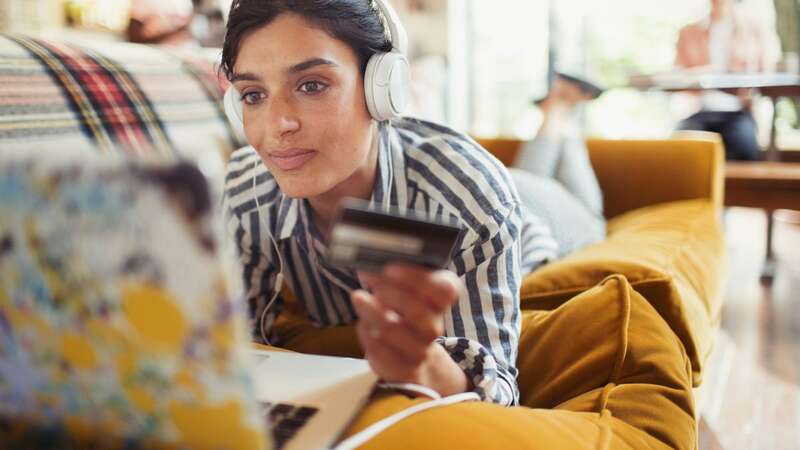 A young woman looking at her laptop (Image: Getty)