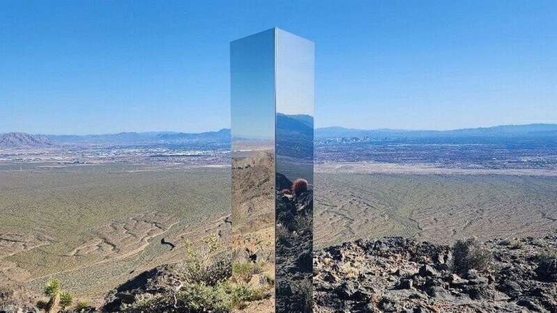 The federal officials have officially removed the shiny 6-foot-4 monolith that mysteriously appeared in the Mojave desert, Las Vegas last weekend. (Image: Las Vegas Metropolitan Police De / SWNS)