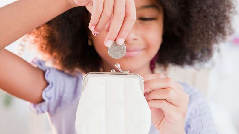 A girl with her pocket money (Image: Getty)