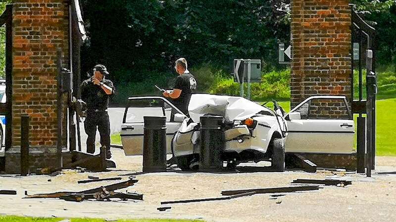 The mangled white vehicle outside the Prime Minister