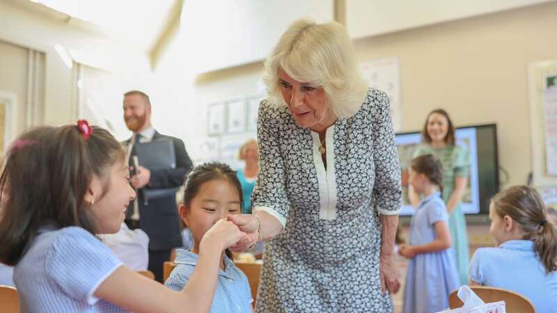 Queen Camilla speaks to pupils in a Year 4 during her visit to Christ Church C of E Primary School in London (Image: PA)