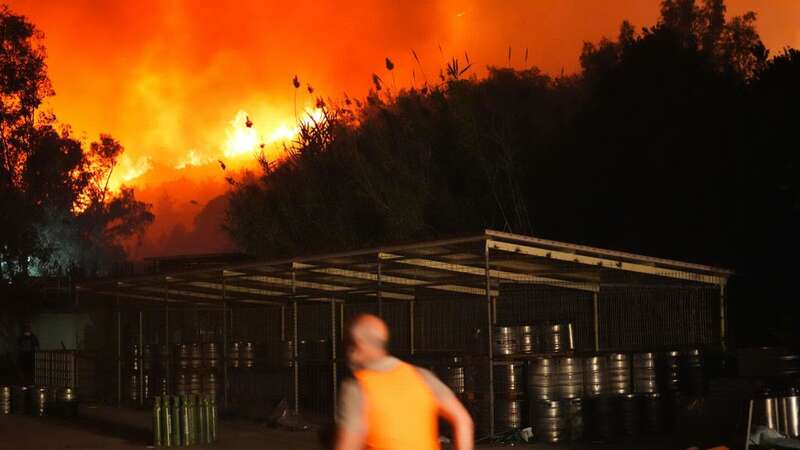 IZMIR, TURKIYE - JUNE 29: Efforts to extinguish the wildfire continue as 2 hotels and many houses around the area are evacuated in Selcuk district of Izmir, Turkiye on June 29, 2024. The wind caused the fire to sprawl through Kusadasi district. (Photo by Mehmet Emin Menguarslan/Anadolu via Getty Images) (Image: Mehmet Emin Menguarslan/Anadolu via Getty Images)