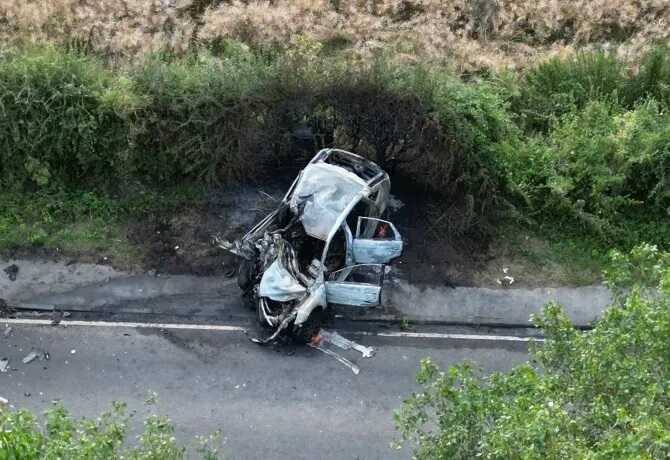 A charred wreck was pictured at the scene after six people died in a horror crashCredit: © YappApp