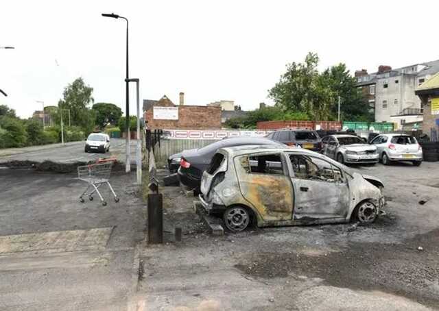 The aftermath of rioting in Hull city centre, showing looted and damaged shops and vehicles ( Image: HullLive/MEN)