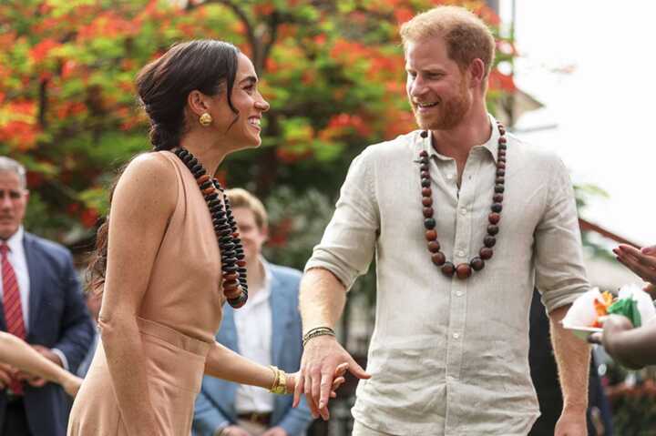 Prince Harry and Meghan Markle arrive hand-in-hand to begin four-day tour of Colombia