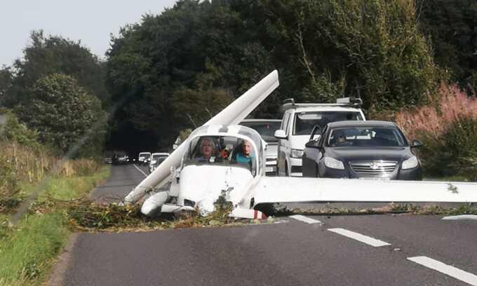 Two pilots survive light aircraft crash on busy road in Gloucestershire