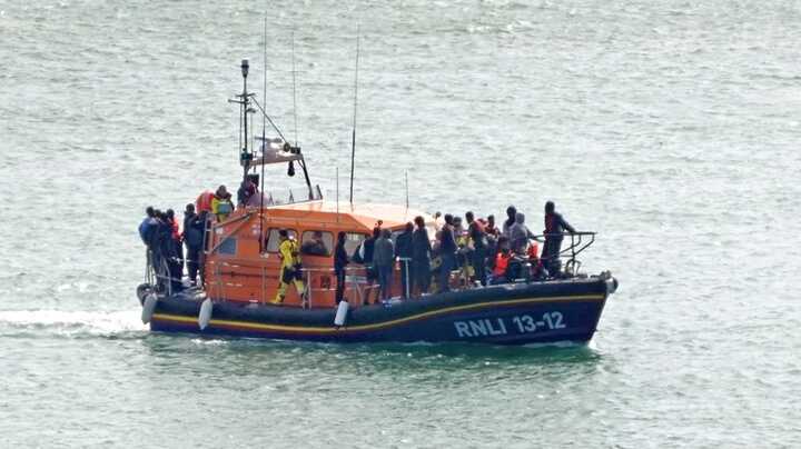 Six children are among the 12 dead after a crowded boat "ripped open" in the Channel