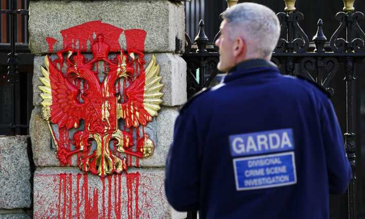 A garda officer at the entrance to the Russian embassy in Dublin in 2022, when red paint had been poured on the coat of arms after Russia’s invasion of Ukraine. Photograph: Brian Lawless/PA