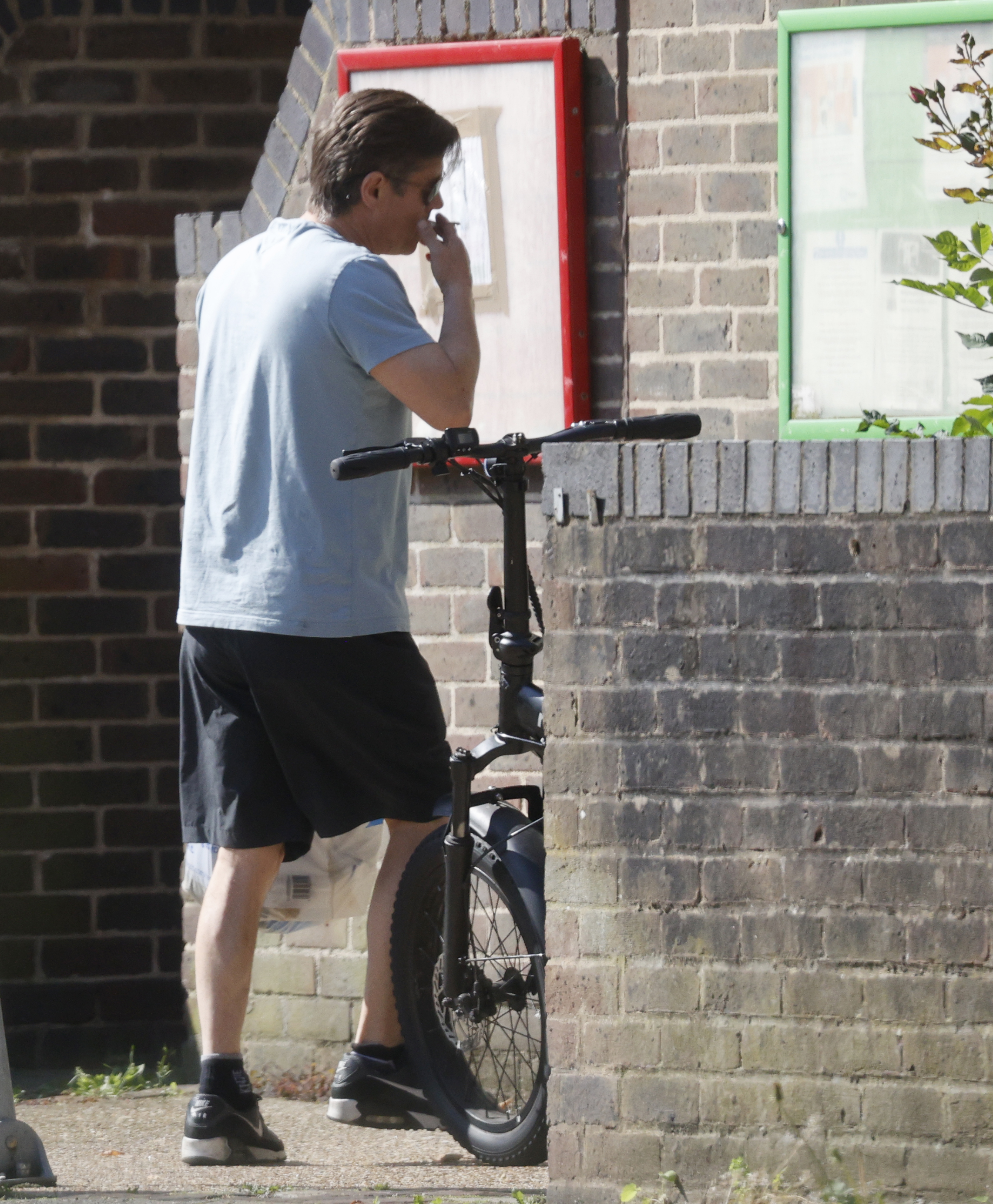 Alford pictured leaving his home on an electric bike